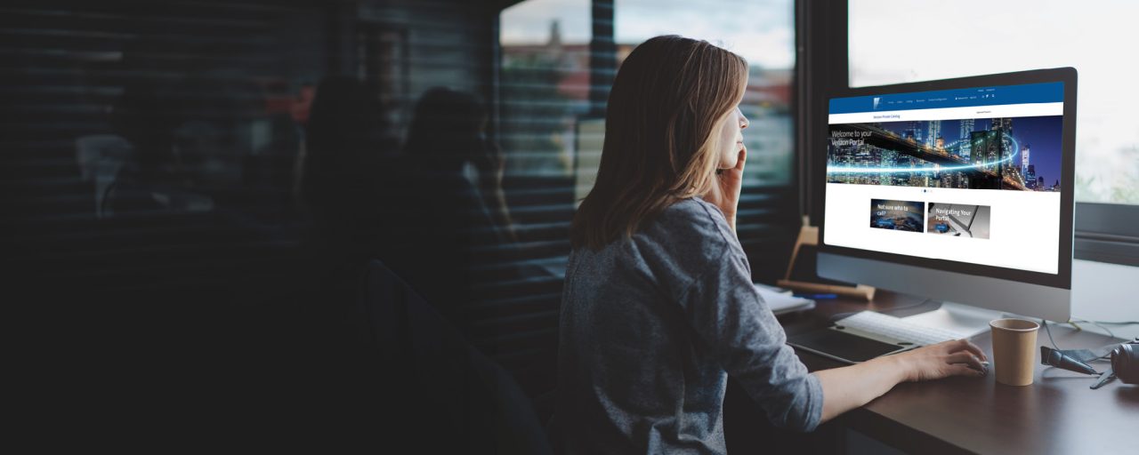 Women in office in front of computer monitor
